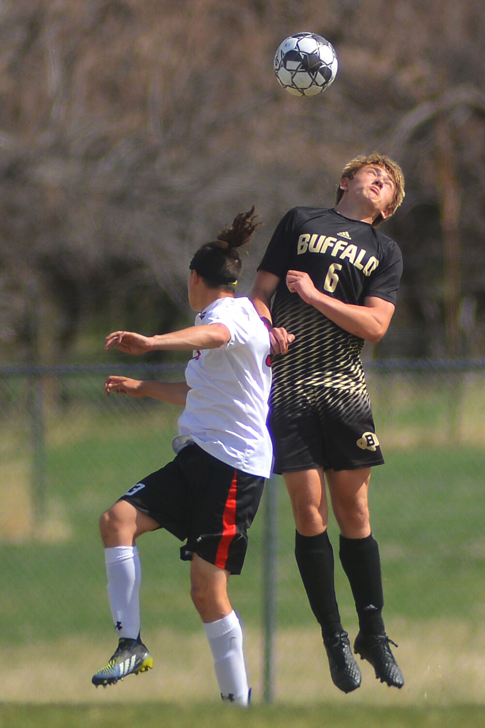 Brogan Byram heads a ball against a Riverton offender